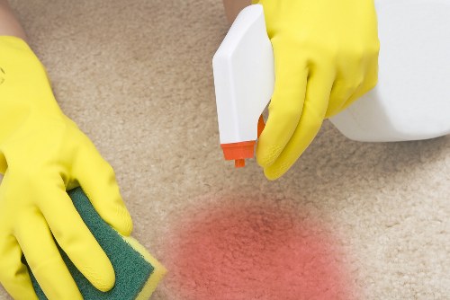 Cleaner using safe practices while working in a tidy indoor space